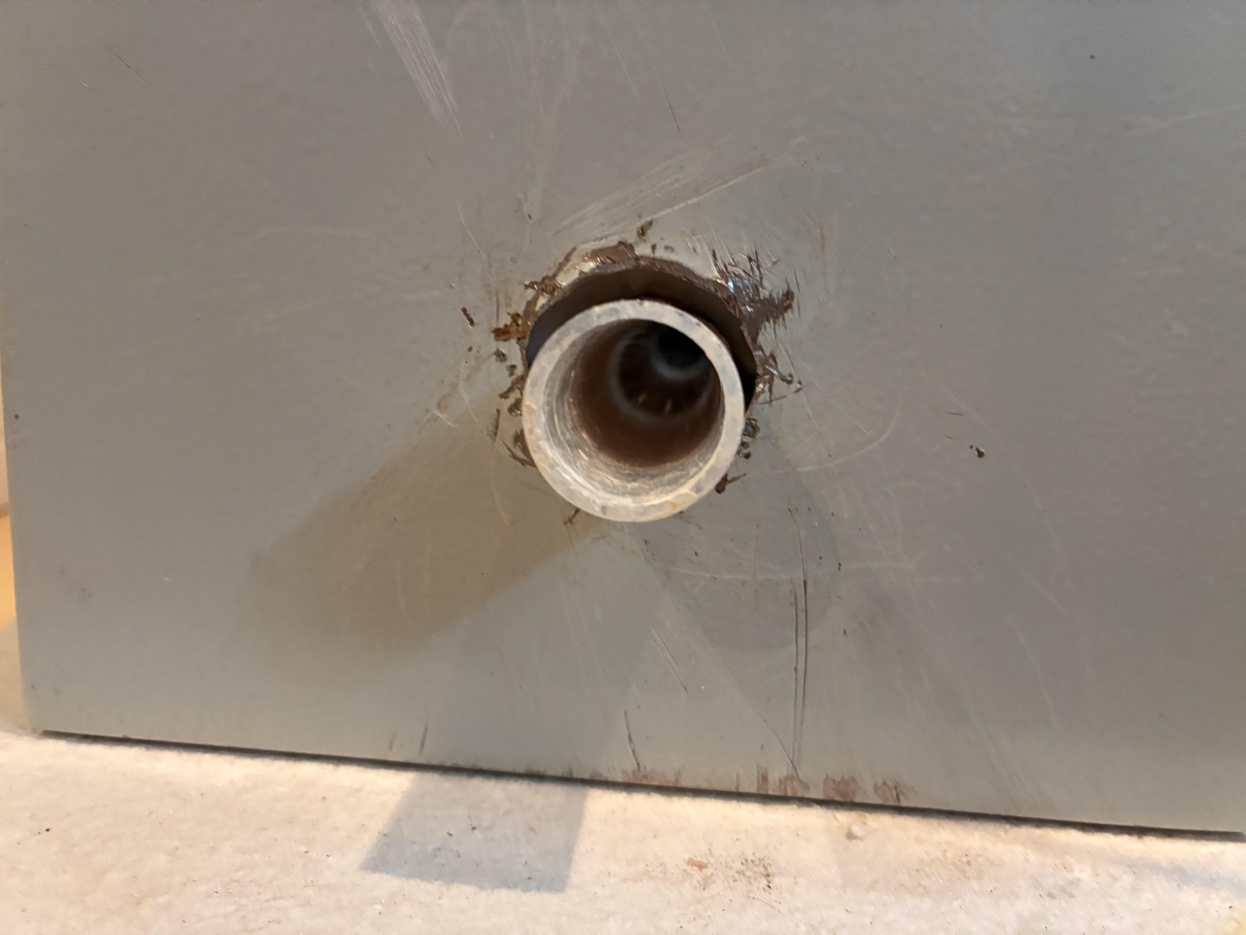Opening cut into the steel enclosure for the tube